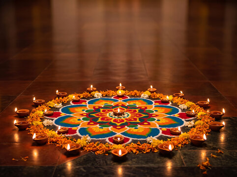 Colorful diya lamps arranged in a circular pattern for diwali celebration
