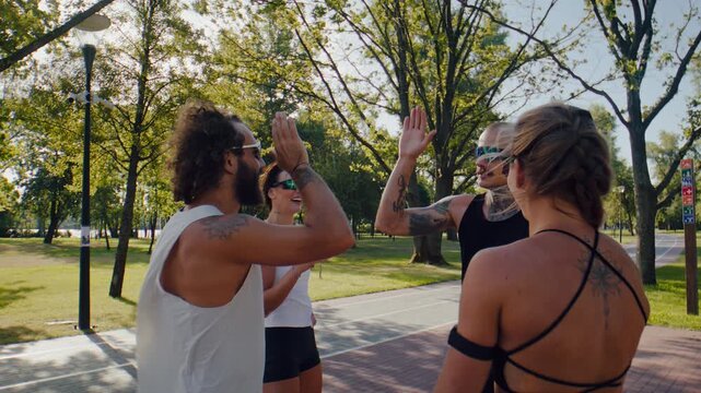 Fitness partners celebrate completed run with friendly high fives
