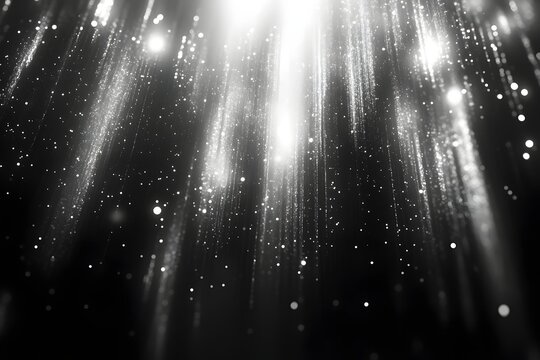 Dramatically glowing white light rays falling down with sparkling dust in darkness