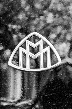 Close-up of the classic Maybach car emblem on the hood in black and white; chrome-plated logo of the German luxury car brand; close-up shot from Tbilisi, Georgia 9.4.25