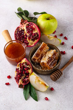 Rosh Hashana Jewish New Year concept with honey apple and pomegranate