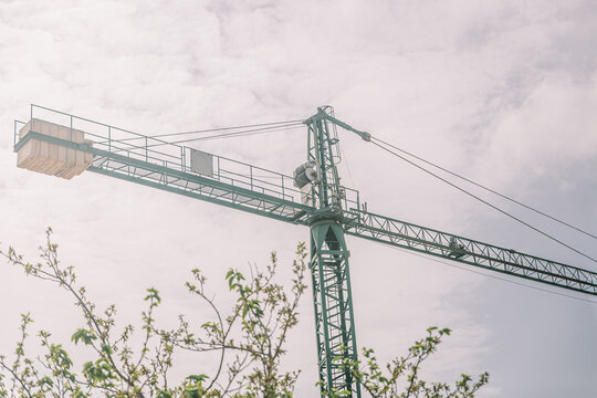 Tower crane reaching into a cloudy sky
