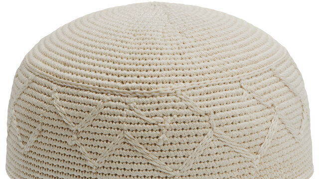 Off-white kufi skullcap showcasing detailed traditional crochet patterns with circular stitching and intricate geometric diamond motifs carefully crafted from high quality durable fabric material isol