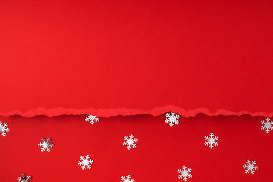 Christmas Torn Red Paper Background with Silver Confetti Snowflakes. Ripped Edge Sheet on Festive Winter Holiday Texture. Creative Flat Lay Border Layout with Large Top Copy Space for Text