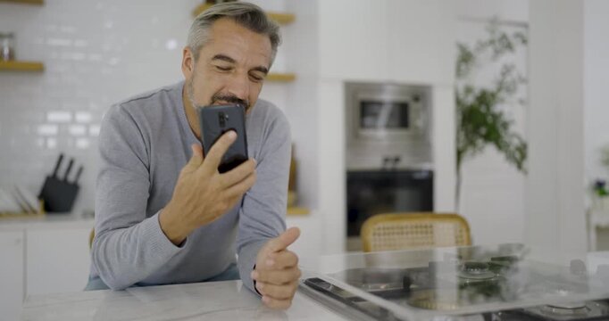 Portrait of happy business senior caucasian man with casual cloths work in home office desk using smart phone Coffee mug. Small business employee freelance online tele market, retire leisure concept