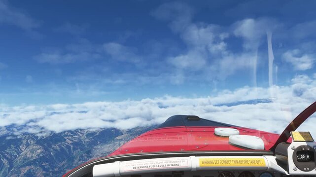 Stunning cockpit view from a red airplane flying high above fluffy white clouds and mountain ranges