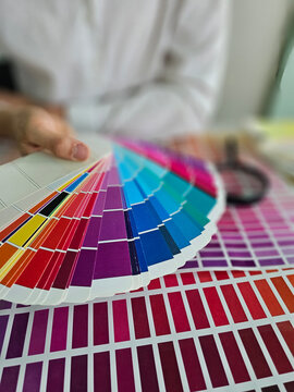 Color swatches are being reviewed for a design project
