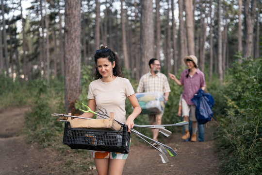 Volunteer group cleaning up forest environment together