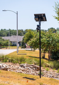 Solar powered automatic license plate reader camera installed on a suburban street pole for traffic monitoring near Georgetown Texas
