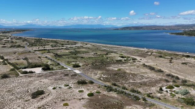 Beautiful aerial view of a serene lakeside area. This footage captures the stunning landscape and the tranquil blue waters. Perfect for nature and travel enthusiasts.