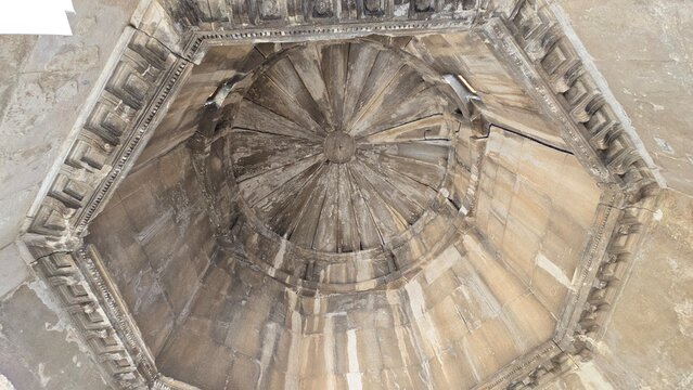 Athens, Greece - 8 July 2026. Upward view inside the Horologion of Andronikos Cyrrhestes, with an octagonal cornice surrounding the radial stone roof and central boss.