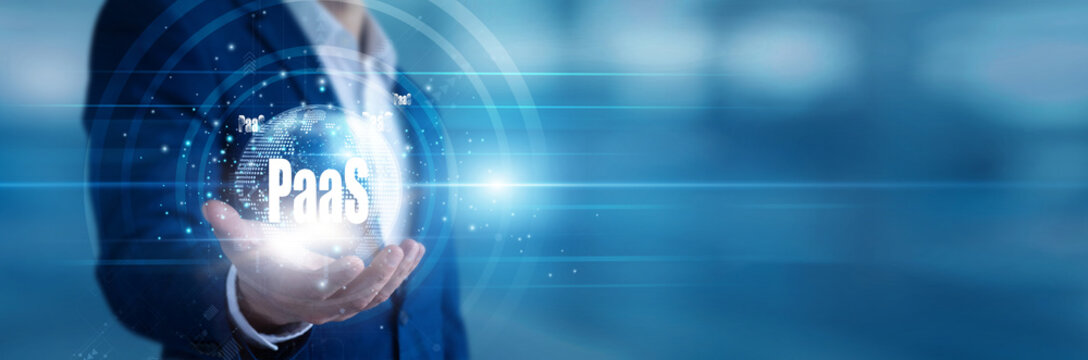 Cloud developer holding a handheld screen deploying PAAS architecture for rapid enterprise apps. Systems engineer managing platform virtualization and streamlining continuous software delivery.