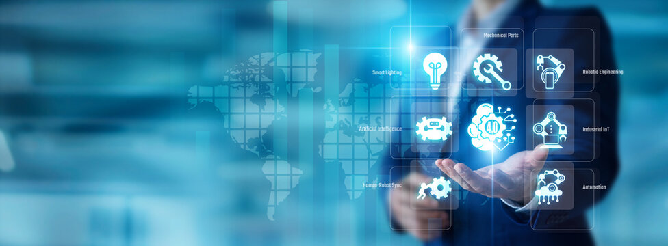 Factory engineer holding a digital twin in hand. Industry 4.0 drives global smart manufacturing and smart factories. Advanced robotic automation upgrades industrial systems.