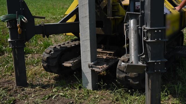 Diesel hammer drives concrete piles for a country house.