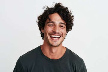 Obraz premium Isolated young man smiling in a minimal white background setting