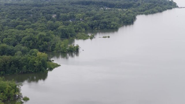 Drone aerial of Hoover Reserver near Westerville, OH and Big Walnut Creek by Columbus, Ohio body of water and manmade lake with trees, expensive house homes, and river ways along midwestern shorelines