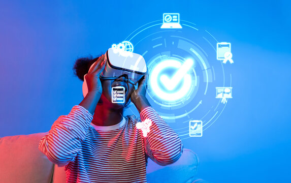 A young individual explores virtual reality as part of a quality management approach, showcasing the intersection of technology and service assurance for innovative solutions. XDMCP