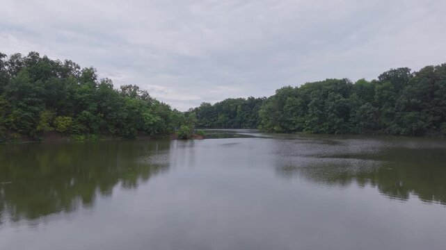 Drone aerial of Hoover Reserver near Westerville, OH and Big Walnut Creek by Columbus, Ohio body of water and manmade lake with trees, expensive house homes, and river ways along midwestern shorelines