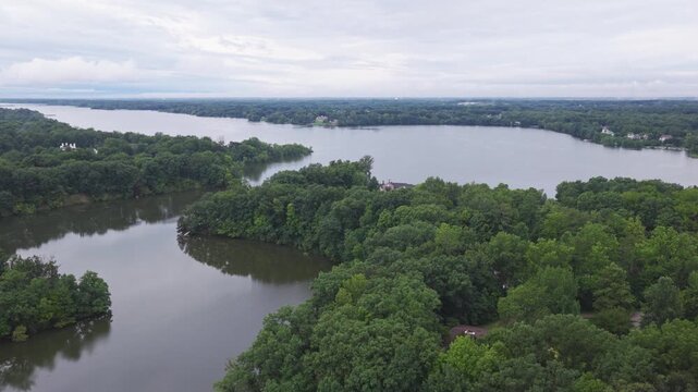 Drone aerial of Hoover Reserver near Westerville, OH and Big Walnut Creek by Columbus, Ohio body of water and manmade lake with trees, expensive house homes, and river ways along midwestern shorelines