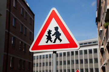 Children road sign in the Czech Republic. Warning symbol for road users in the city. Drive with caution because of crossing kids. © Felix Geringswald