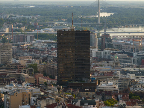 Aerial view of the Beogradanka building rising above the historic urban landscape with the Sava river and Ada Bridge in the background in Belgrade, City of Belgrade, Serbia.