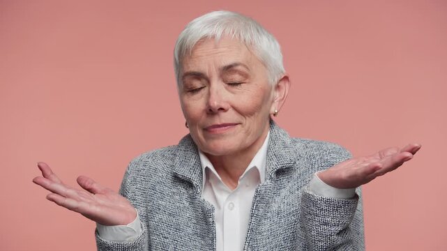 Clueless Senior Woman Shrugging With Confused Expression