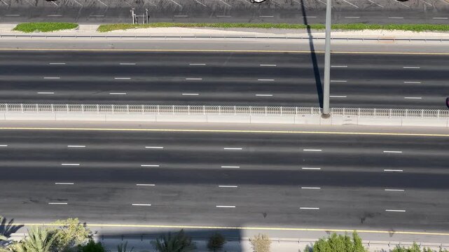 High angle view of highway traffic along the waterfront marina in Manama, Bahrain.