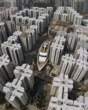 Skyscrapers with boat in Hong Kong from the air, drone recording, China