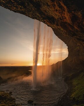 Seljalandsfoss waterfall at midnight sun, Southern Iceland, Iceland