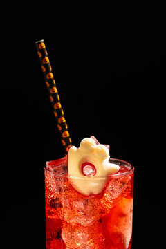 Festive Halloween Cocktail with Themed Straw and Ghost Garnish Perfect for Celebrations and Parties