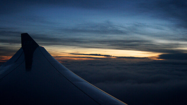 Stockholm, Sweden, December 10 2015: Wing view after takeoff during sunset