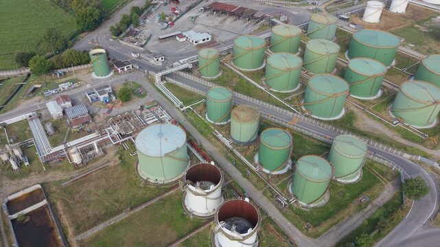 Industrial Oil Tank Farm with Large Green Storage Tanks &ndash; Aerial Drone Footage