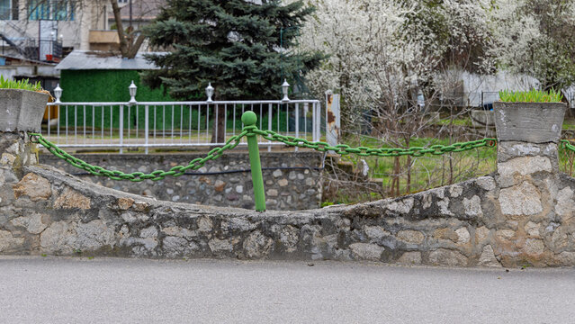 Green Chain Fence Park Garden in Town Orsova Romania Spring Day