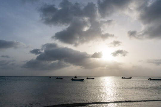 Dramatic sunlit cloudscape reflected across the Caribbean Sea at Manchineel Bay, also known as Manzanillo Beach, near Bottom House, Providencia Island, Colombia
