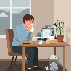 Fototapeta premium Man Sneezing At Home Office Desk During Cold Season Illness