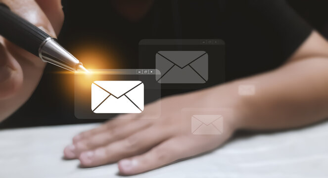Professional hand managing digital email correspondence through interactive virtual interface icons for effective global business communication workflow