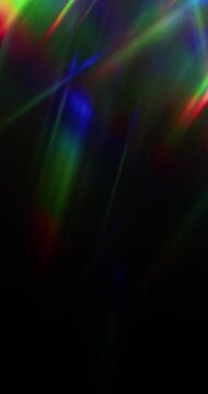 Lights shining into a prism causing an optical effect of a brilliant rainbow of dancing light rays. Light reflect creating a visual of a dreamy burst of light shining and sparkling. Seamless Loop.