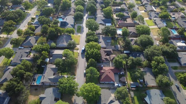 Straight residential avenues bisect quiet single family tracts west of Precinct Line Road. Neatly kept lawns, backyard pools, mature hardwood canopies showcase peaceful living, Hurst, Texas