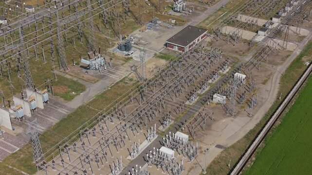 Drone View of High Voltage Electrical Substation and Power Transmission Infrastructure in Badile,  Italy