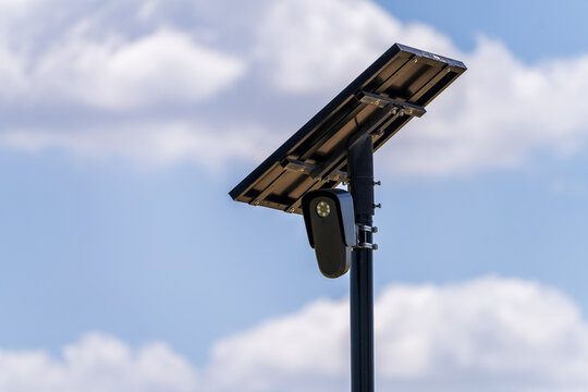Solar powered automatic license plate reader camera installed on a suburban street pole for traffic monitoring near Georgetown Texas