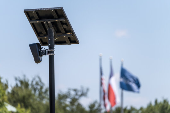 Solar powered automatic license plate reader camera installed on a suburban street pole for traffic monitoring near Georgetown Texas