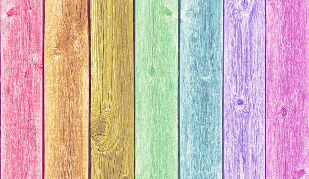 colorful fence or panel of wooden boards with vertical stripe effect
