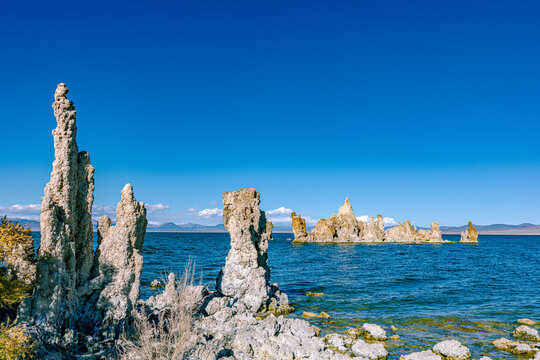 A tall tufa spire stands above the deep blue waters of Mono Lake, California's saline lake.