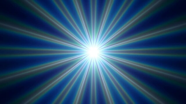 Radiant white light burst with blue and green rays spreading across a dark background