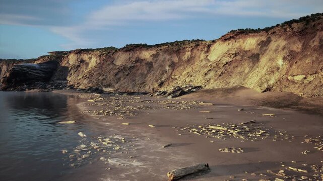 Shattered cliffs show resilient shoreline change, Eroded cliffs and rugged shoreline depict persistent coastal retreat amid shifting weather conditions