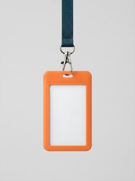 Blank orange plastic id badge holder with a blue lanyard hanging against a plain light background