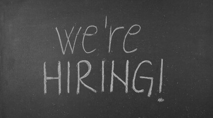 Were hiring text written on blackboard © Predrag