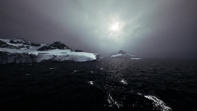 low sunlight breaks over black ocean, scattered ice and reflective ripples create stark contrast, moody palette suited for adventure, climate, or abstract