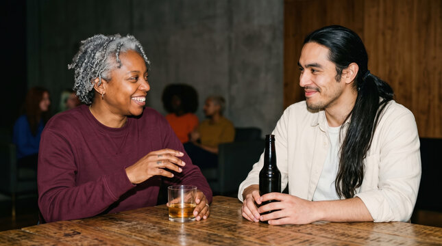 Diverse friends enjoy drinks and conversation at bar