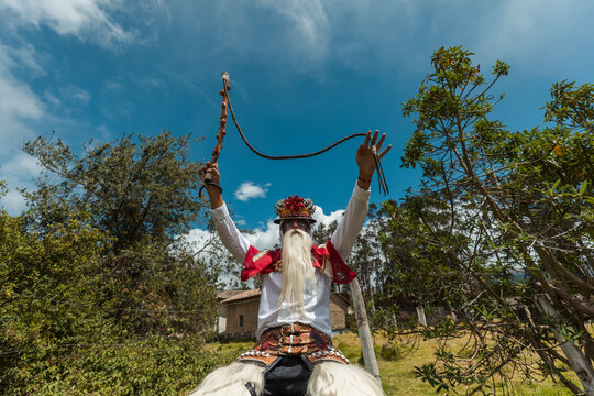 Chivo character in traditional attire performing at the cultural festival of Zuleta, Ecuador
